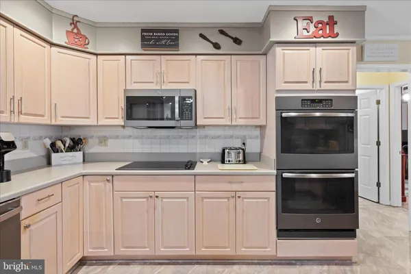 a bedroom with a bed couch and a window