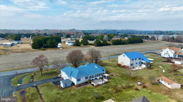 an aerial view of a house with outdoor space