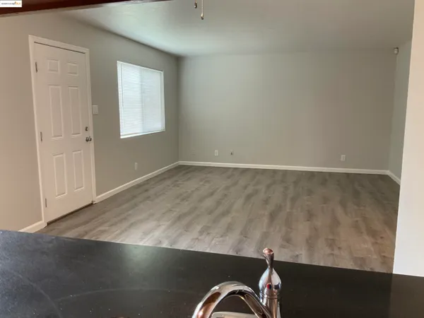 an empty room with wooden floor