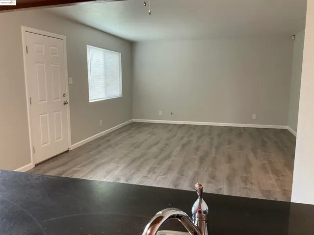 an empty room with wooden floor