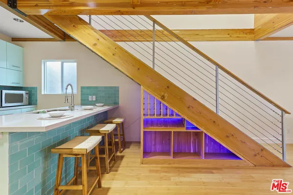 a view of a balcony with seating space