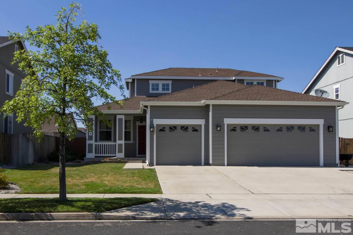 8903 Wynne Street Reno, NV 89506 - Photo 1 of 17 a front view of a house with a garden