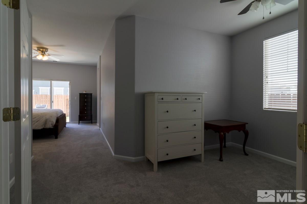 8903 Wynne Street Reno, NV 89506 - Photo 11 of 17 a view of a bedroom with a furniture