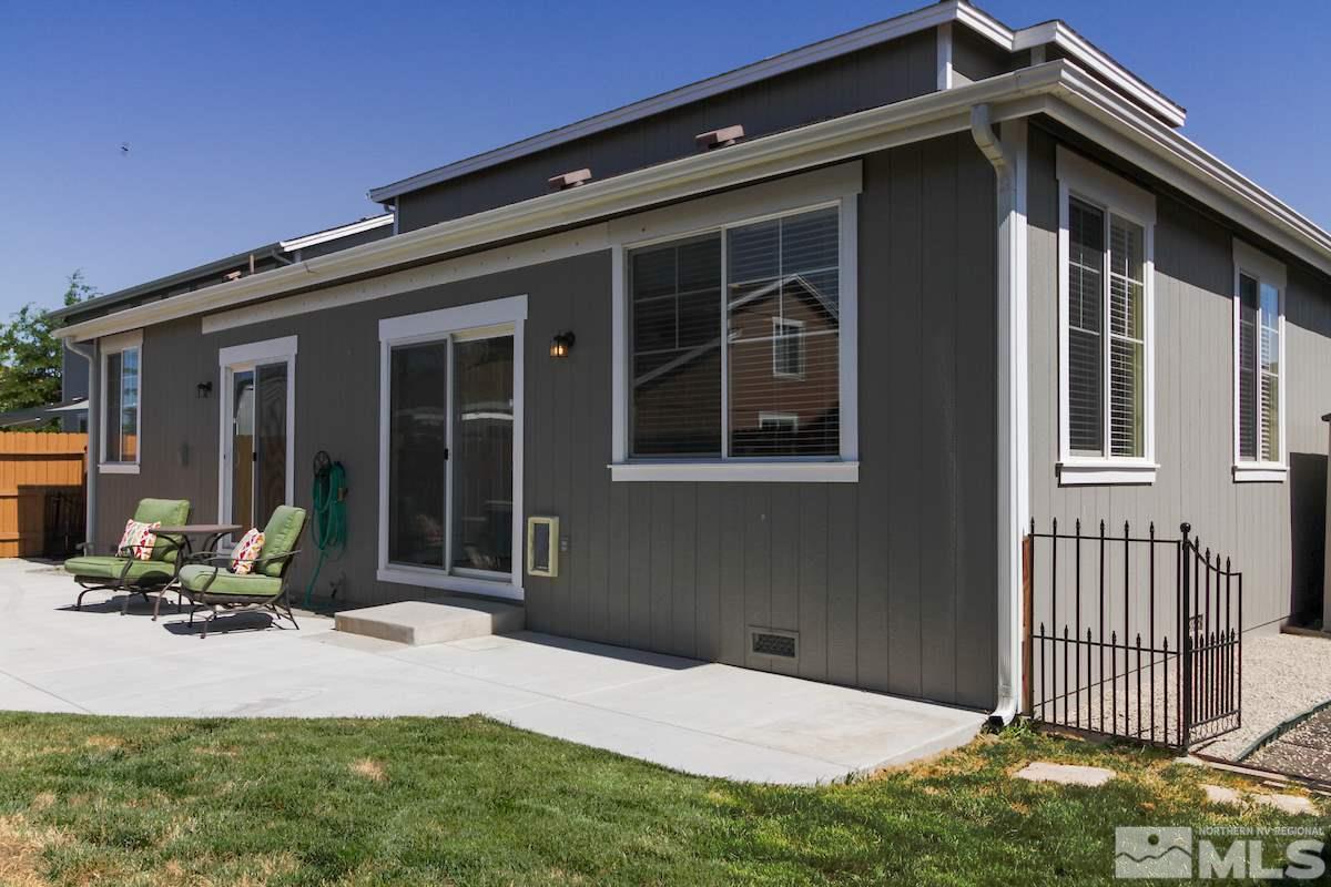 8903 Wynne Street Reno, NV 89506 - Photo 15 of 17 a backyard of a house with table and chairs