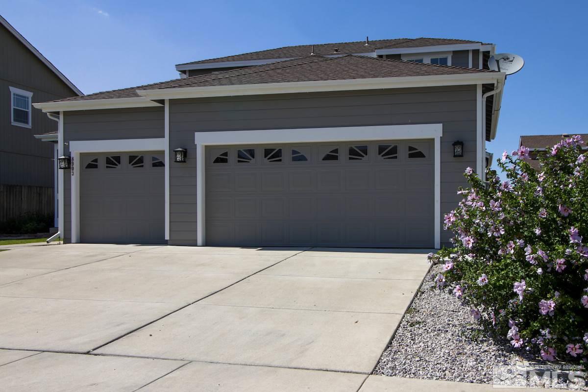 8903 Wynne Street Reno, NV 89506 - Photo 2 of 17 a front view of a house with garage