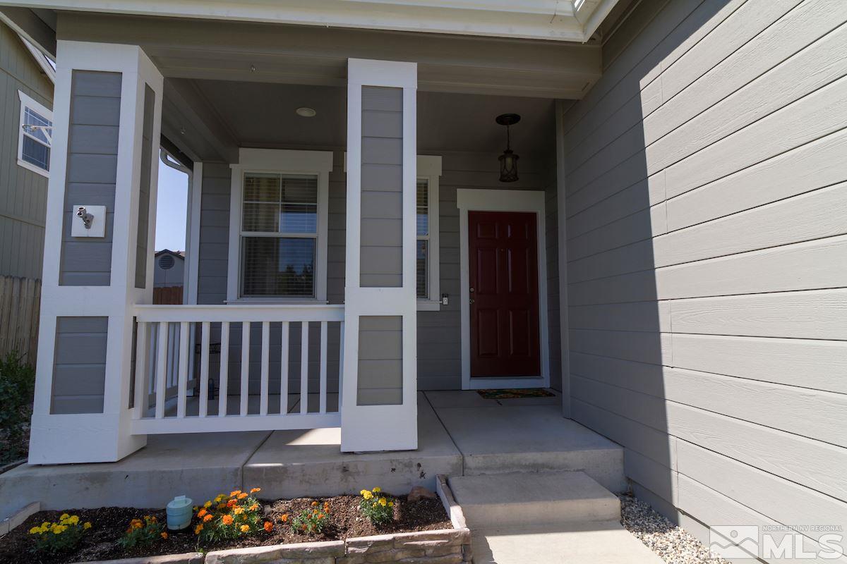 8903 Wynne Street Reno, NV 89506 - Photo 3 of 17 a view of a porch with a chair