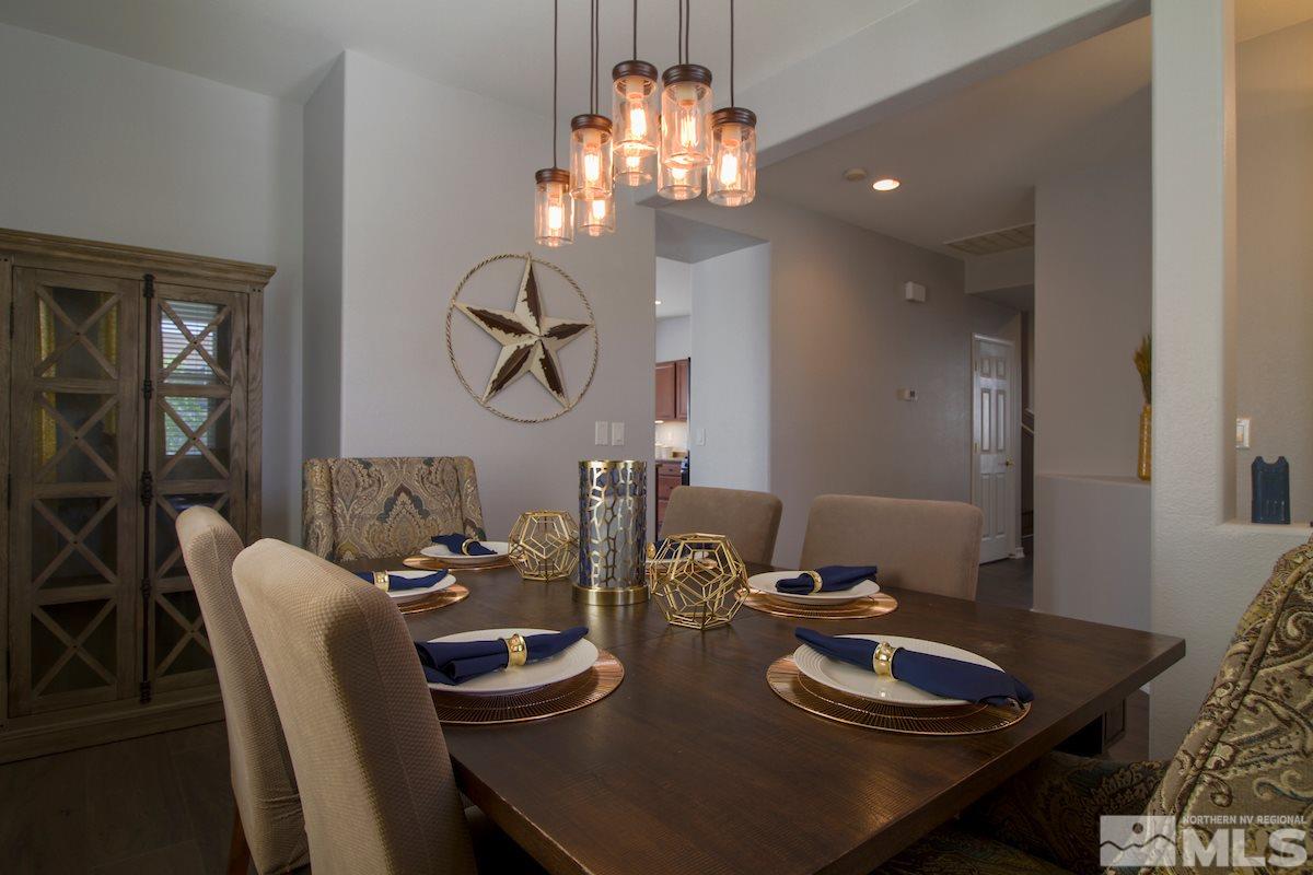 8903 Wynne Street Reno, NV 89506 - Photo 4 of 17 a table room with furniture and chandelier