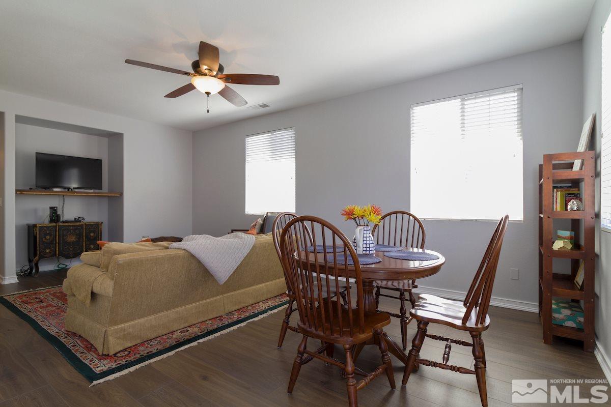 8903 Wynne Street Reno, NV 89506 - Photo 5 of 17 a bedroom with a bed and a chandelier