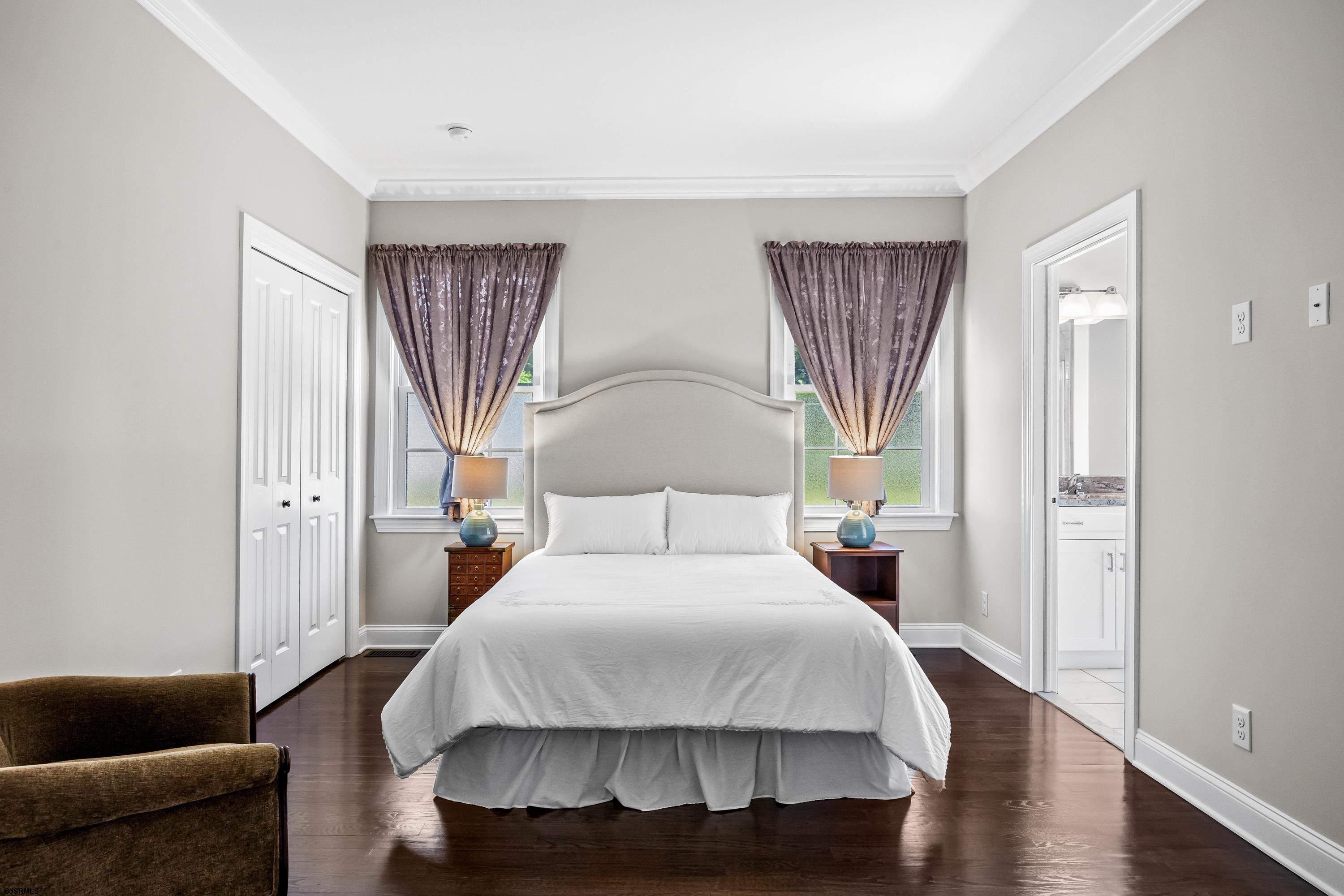 215 Surf Road Egg Harbor Township, NJ 08234 - Photo 14 of 31 a bedroom with a bed a couch and dresser