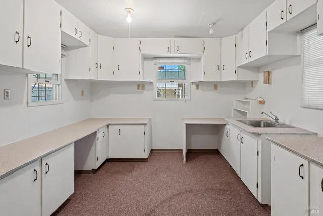 a view of hallway with white walls