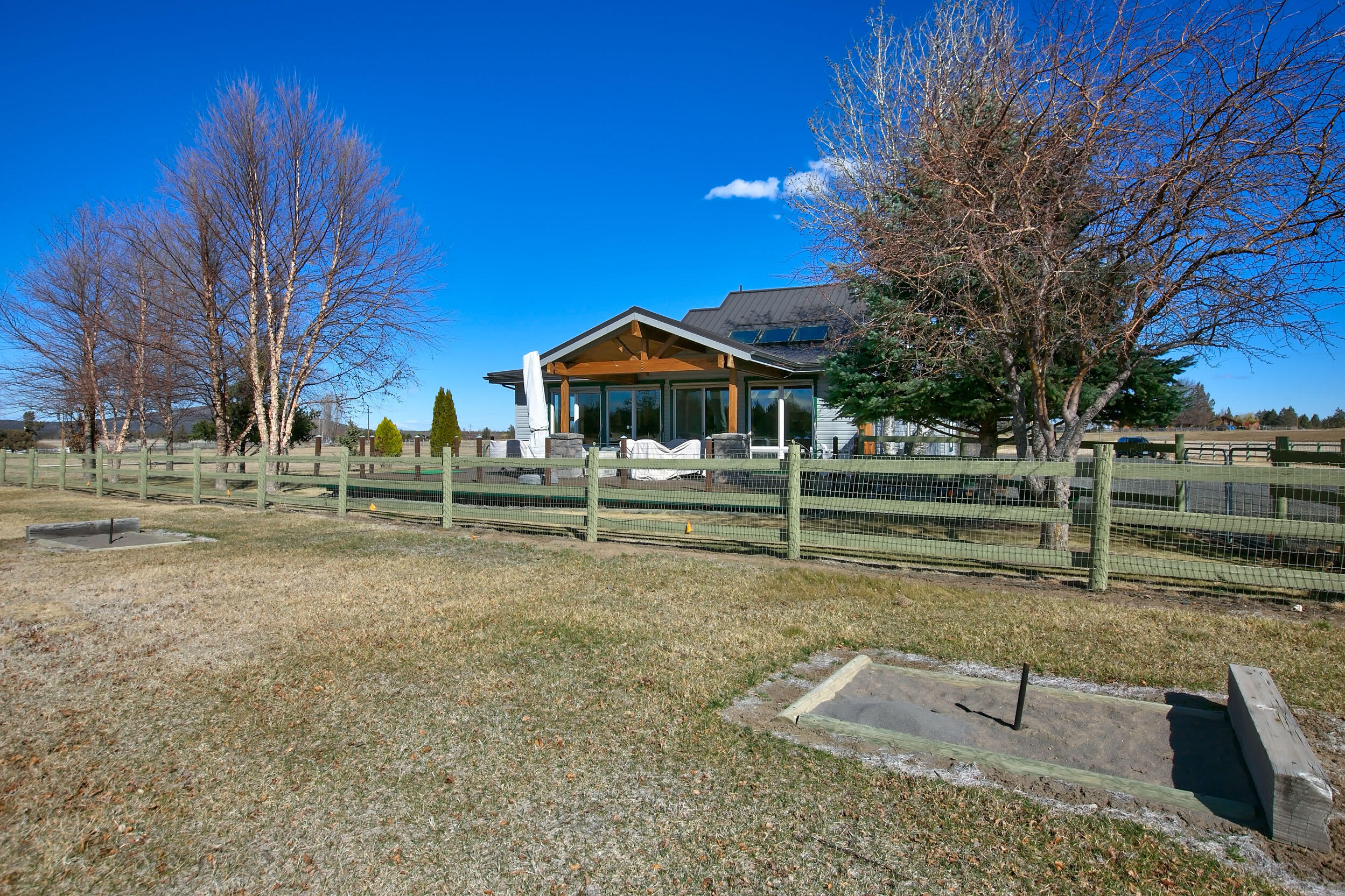 20155 Marsh Road Bend, OR 97703 - Photo 22 of 39 a backyard of a house with lots of green space
