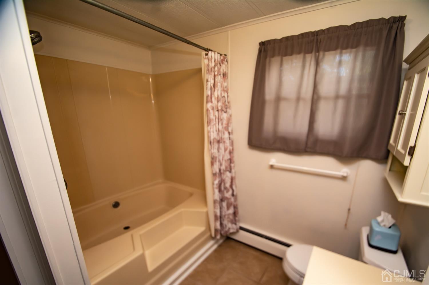 47 Poe Road North Brunswick, NJ 08902 - Photo 14 of 19 a bathroom with a shower and a toilet