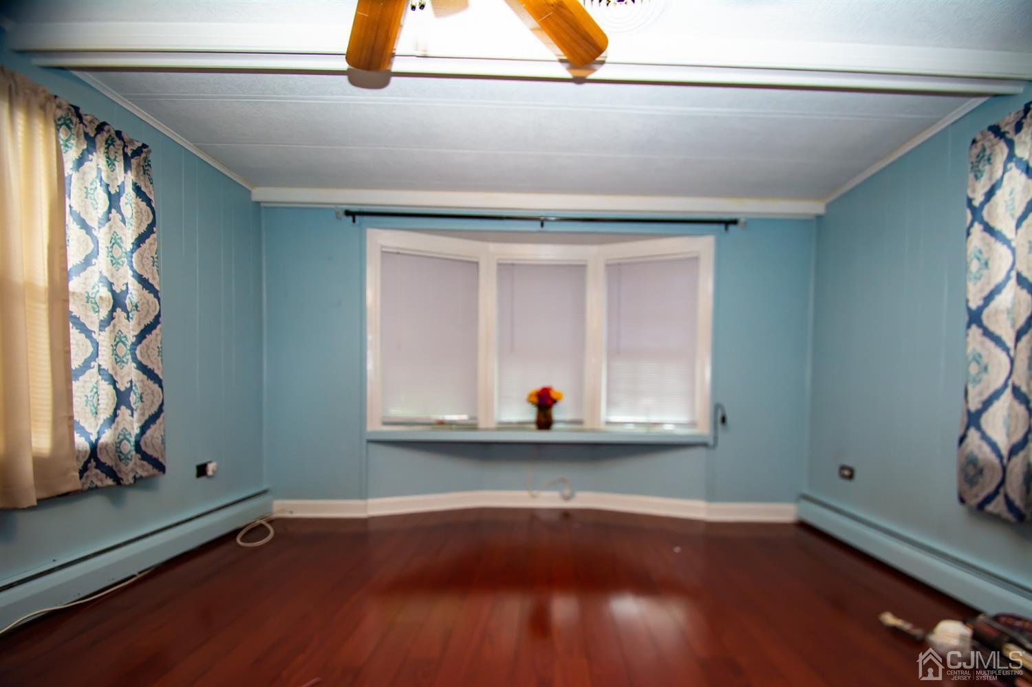 47 Poe Road North Brunswick, NJ 08902 - Photo 9 of 19 a view of a room with wooden floor and cabinets
