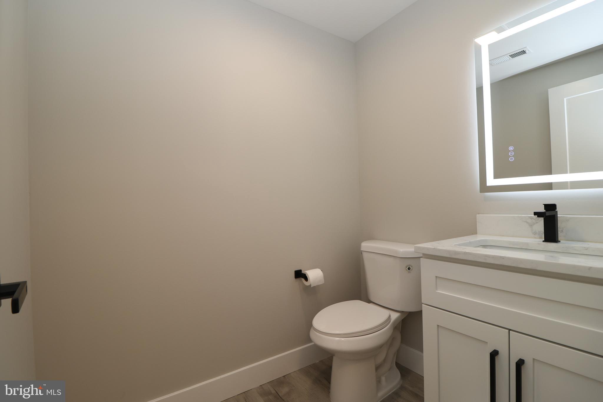 610 Burton Road Oreland, PA 19075 - Photo 31 of 77 Half Bath with Lighted Mirror