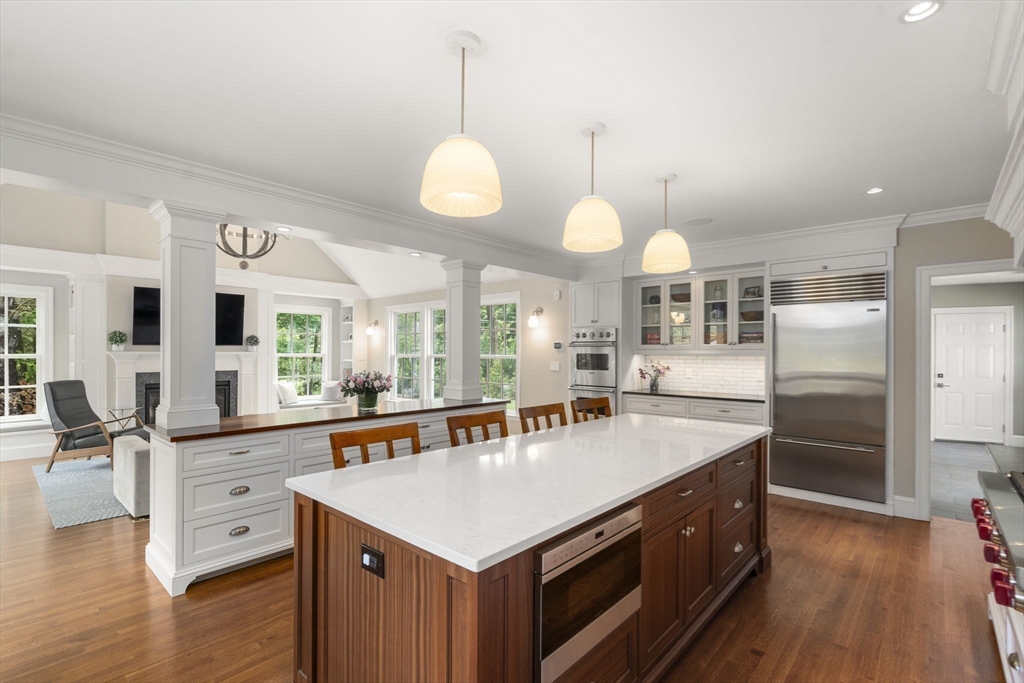 12 Pheasant Landing Road Needham, MA 02492 - Photo 15 of 42 a large kitchen with kitchen island a large counter space and stainless steel appliances