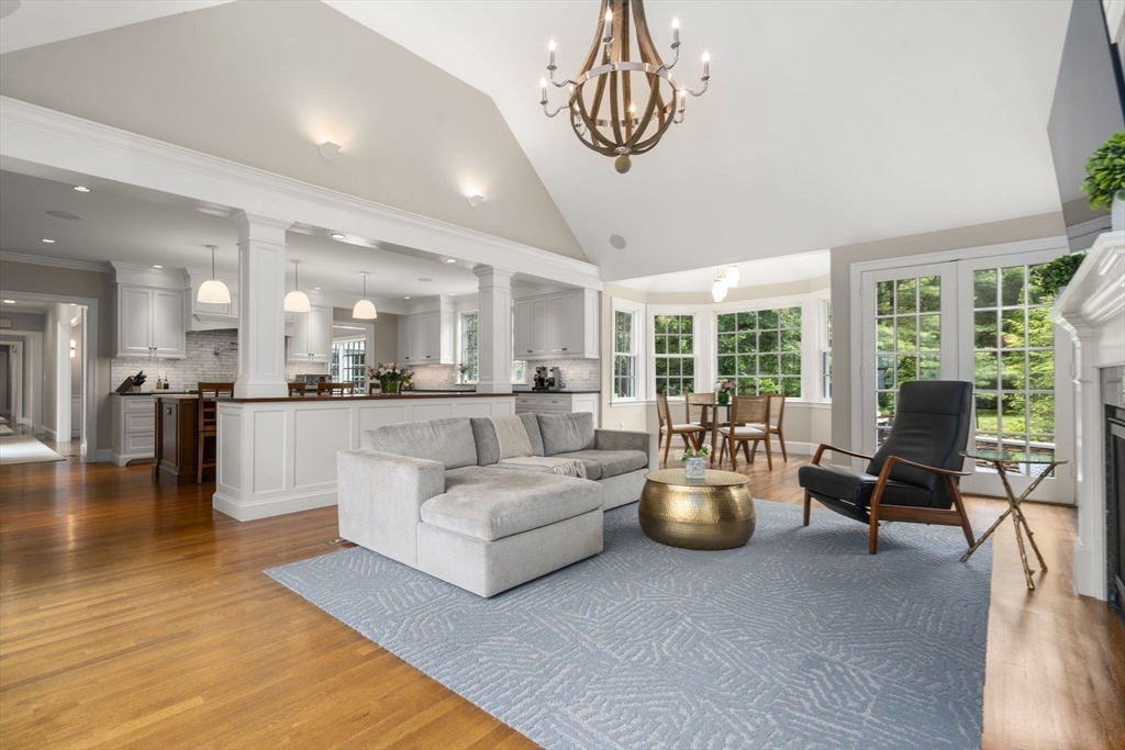 12 Pheasant Landing Road Needham, MA 02492 - Photo 16 of 42 a living room with furniture or kitchen and a chandelier