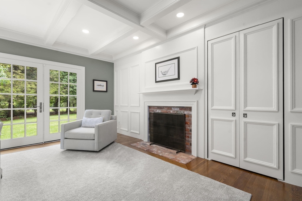 12 Pheasant Landing Road Needham, MA 02492 - Photo 20 of 42 a living room with furniture and a fireplace