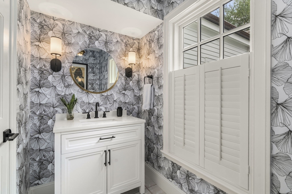 12 Pheasant Landing Road Needham, MA 02492 - Photo 28 of 42 a bathroom with a sink vanity and a mirror