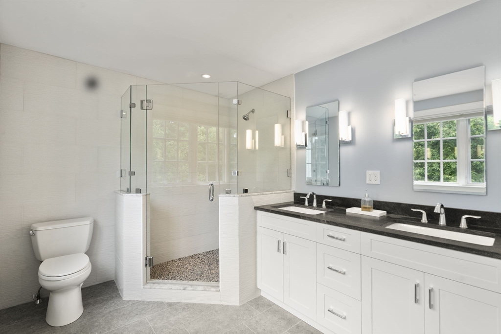 12 Pheasant Landing Road Needham, MA 02492 - Photo 31 of 42 a bathroom with double sink and a mirror