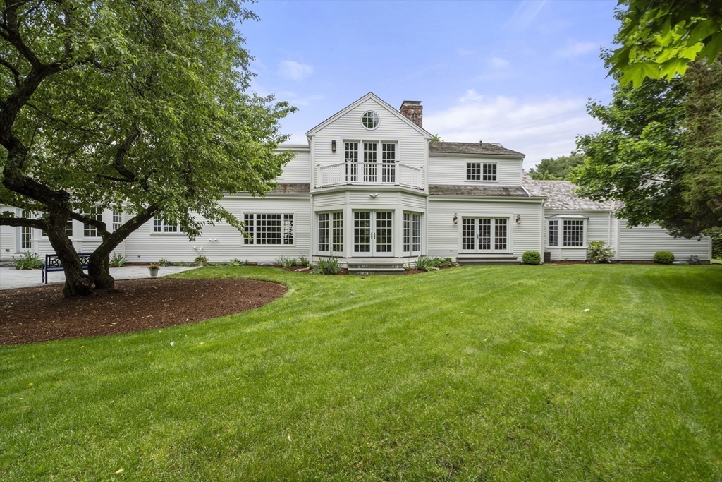 12 Pheasant Landing Road Needham, MA 02492 - Photo 37 of 42 a front view of a house with a garden