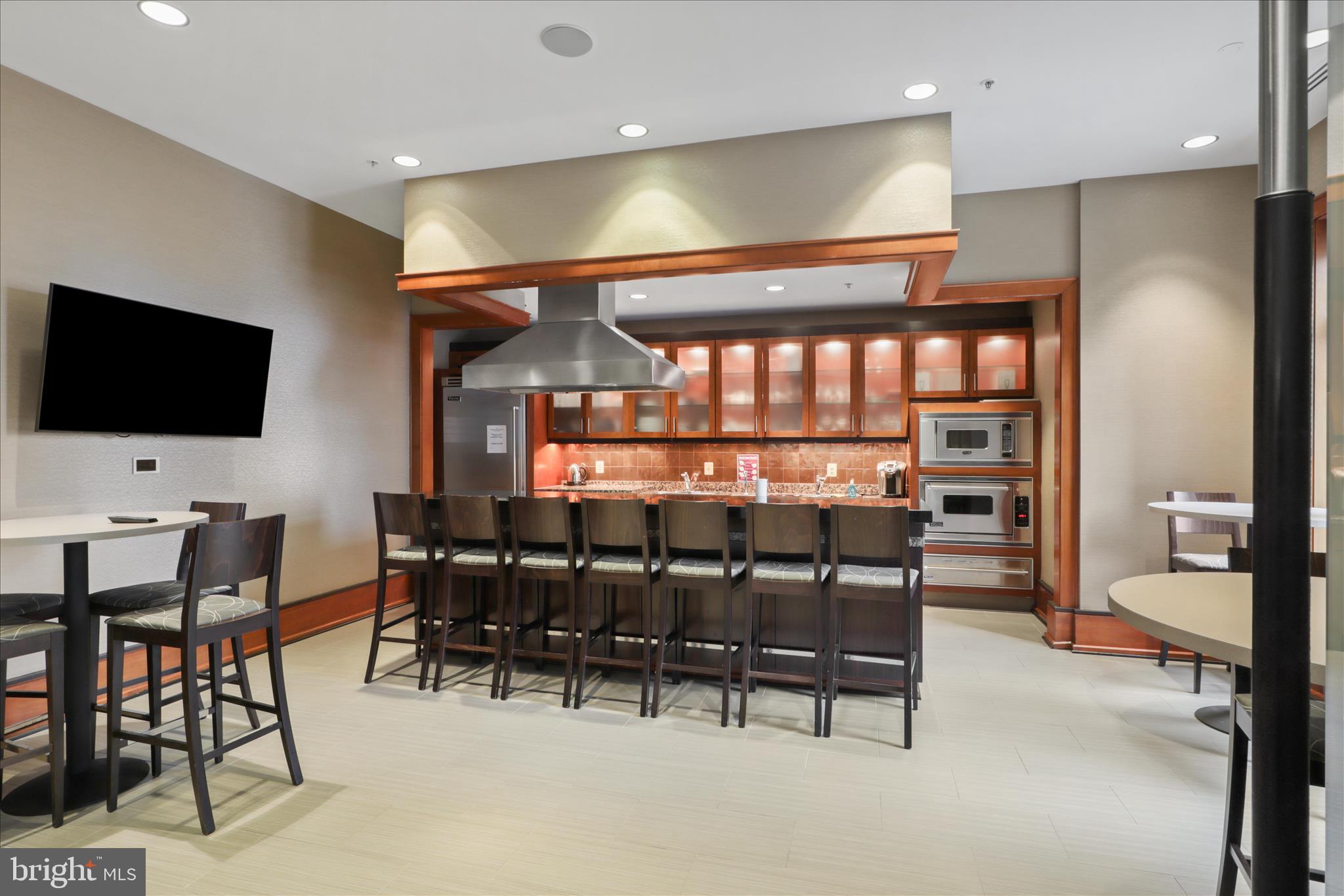 11990 Market Street, Unit 216 Reston, VA 20190 - Photo 13 of 41 a view of a a dining room with furniture