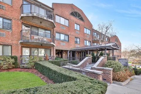 a front view of a building with garden