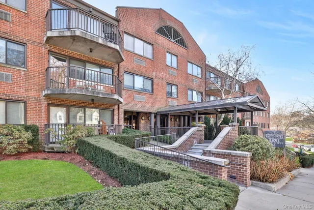 a front view of a building with garden
