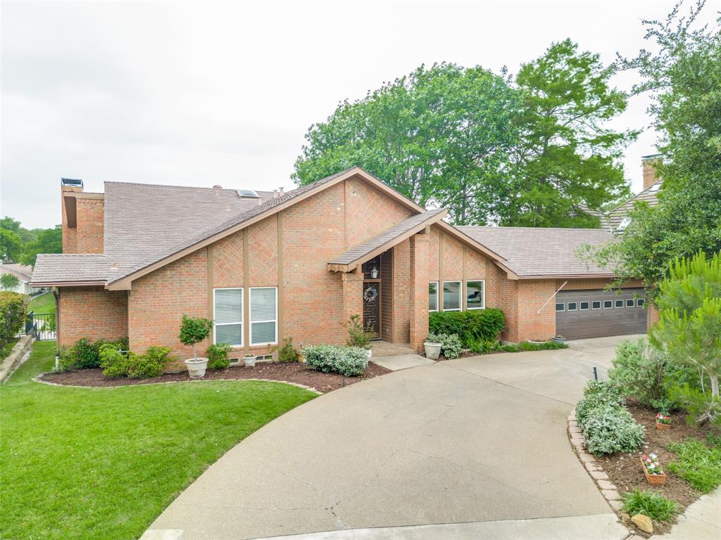 3213 Hidalgo Street Irving, TX 75062 - Photo 1 of 1 a view of a house with a yard and potted plants