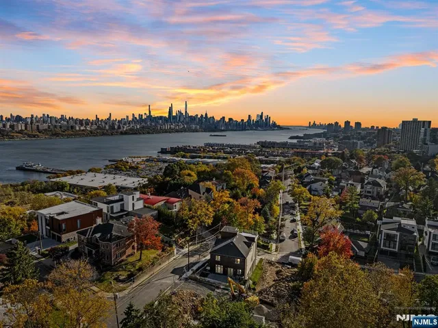 a view of a brick house with many windows