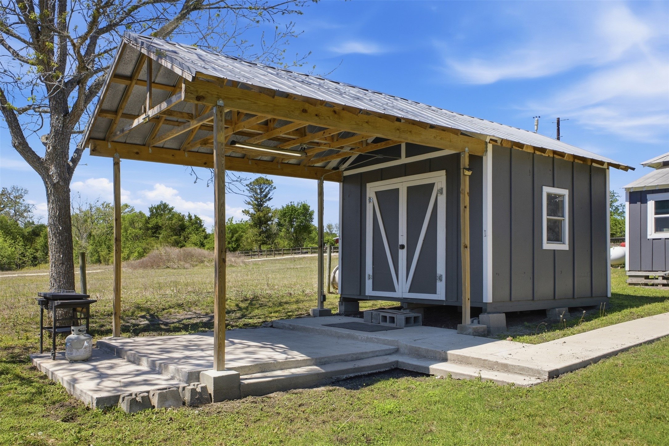 1903 Tigerpoint Road Brenham, TX 77833 - Photo 22 of 27 a view of a backyard with a garden