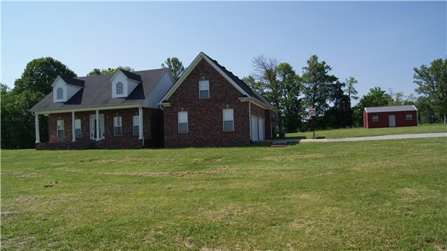363 West Hester Road Cottontown, TN 37048 - Photo 11 of 14 a front view of a house with a garden