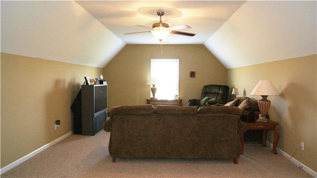 363 West Hester Road Cottontown, TN 37048 - Photo 12 of 14 a living room with furniture and a chandelier
