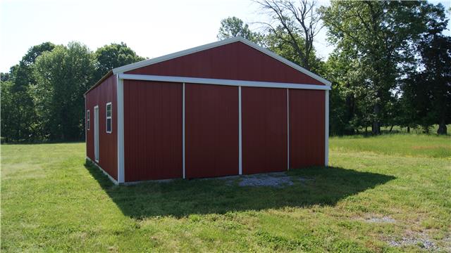 363 West Hester Road Cottontown, TN 37048 - Photo 5 of 14 a view of a small barn with wooden fence