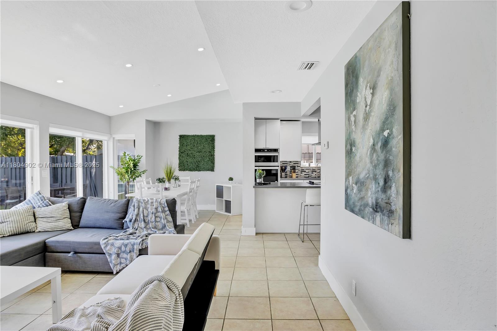 2828 Cleveland Street Hollywood, FL 33020 - Photo 14 of 23 a living room with furniture and a flat screen tv