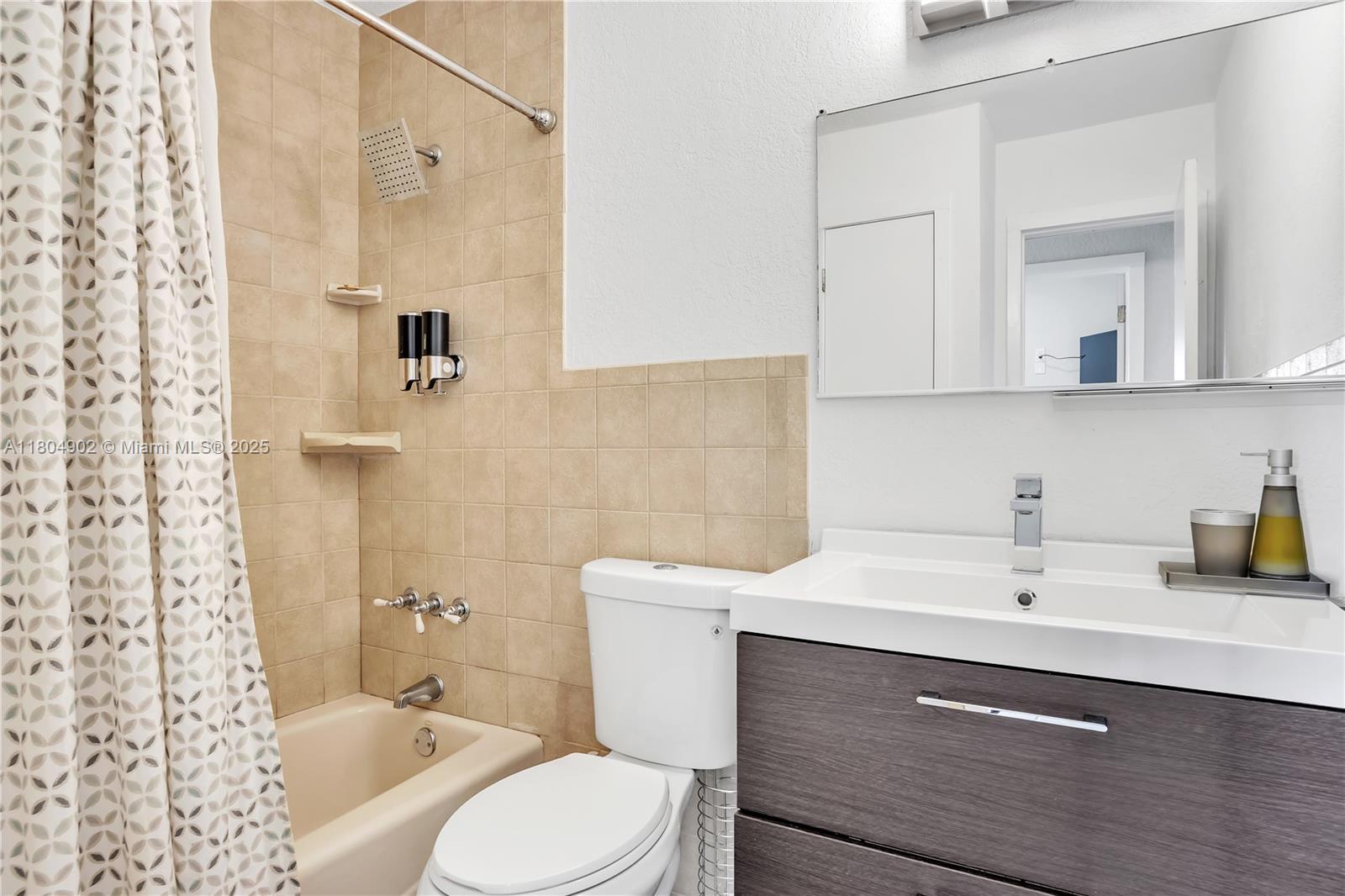2828 Cleveland Street Hollywood, FL 33020 - Photo 16 of 23 a bathroom with a sink a toilet and shower