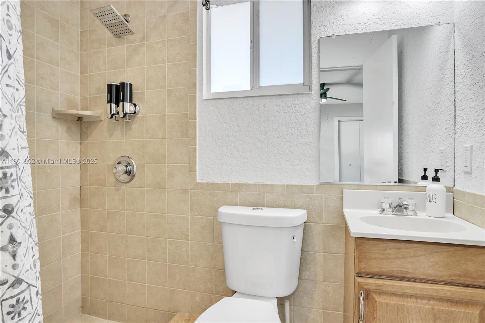 2828 Cleveland Street Hollywood, FL 33020 - Photo 18 of 23 a bathroom with a sink toilet and shower