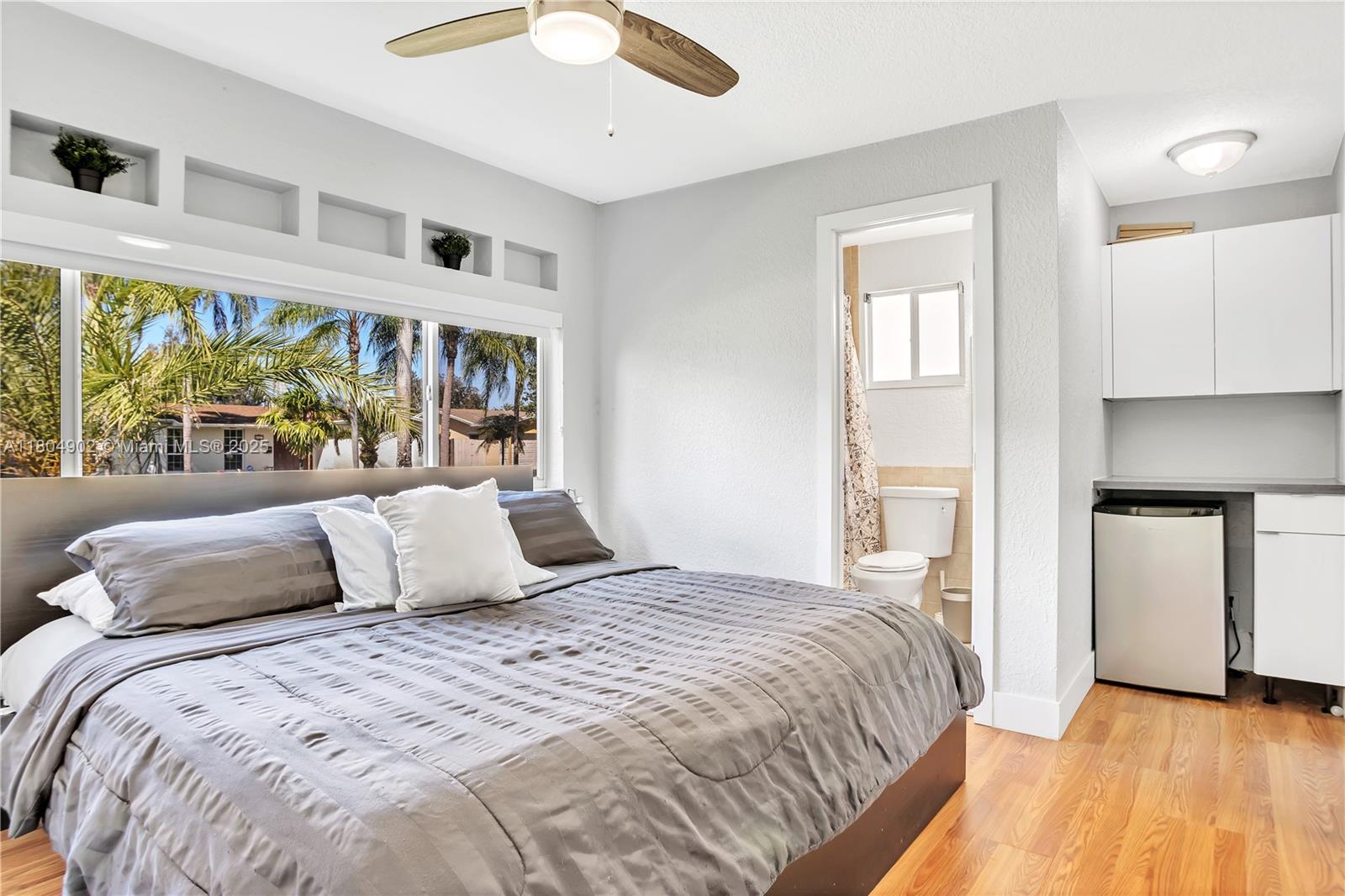 2828 Cleveland Street Hollywood, FL 33020 - Photo 21 of 23 a bedroom with a bed and a window