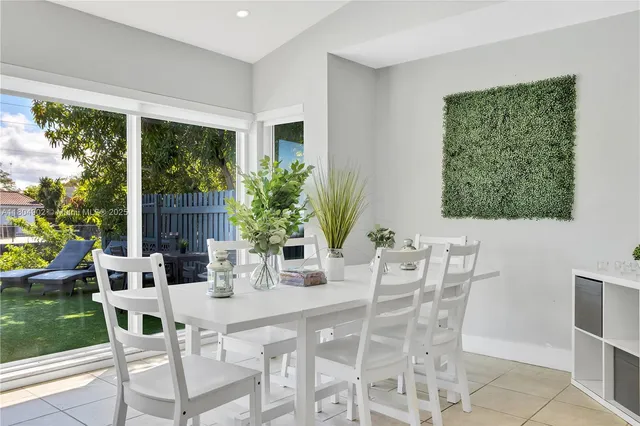 a kitchen with stainless steel appliances kitchen island granite countertop a sink a counter top space cabinets and wooden floor