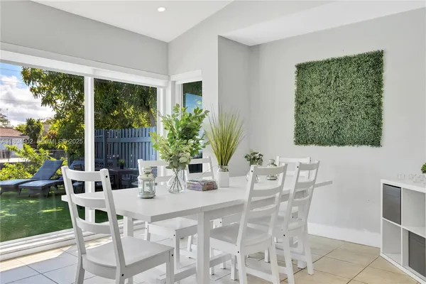 a kitchen with kitchen island granite countertop stainless steel appliances a sink and a counter top space