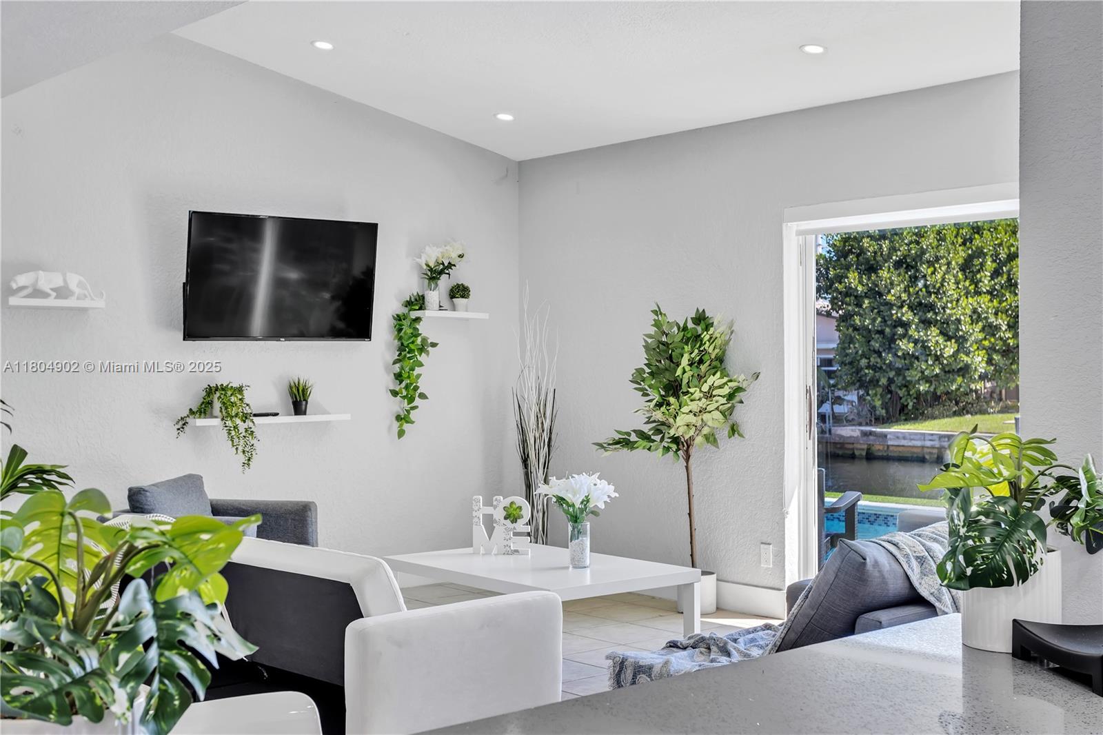 2828 Cleveland Street Hollywood, FL 33020 - Photo 5 of 23 a living room with furniture and a potted plant