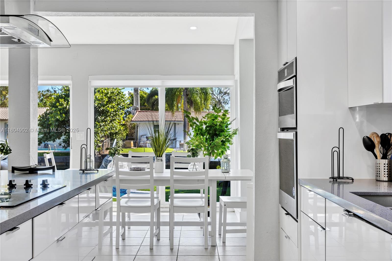 2828 Cleveland Street Hollywood, FL 33020 - Photo 6 of 23 a view of a kitchen with furniture and large windows