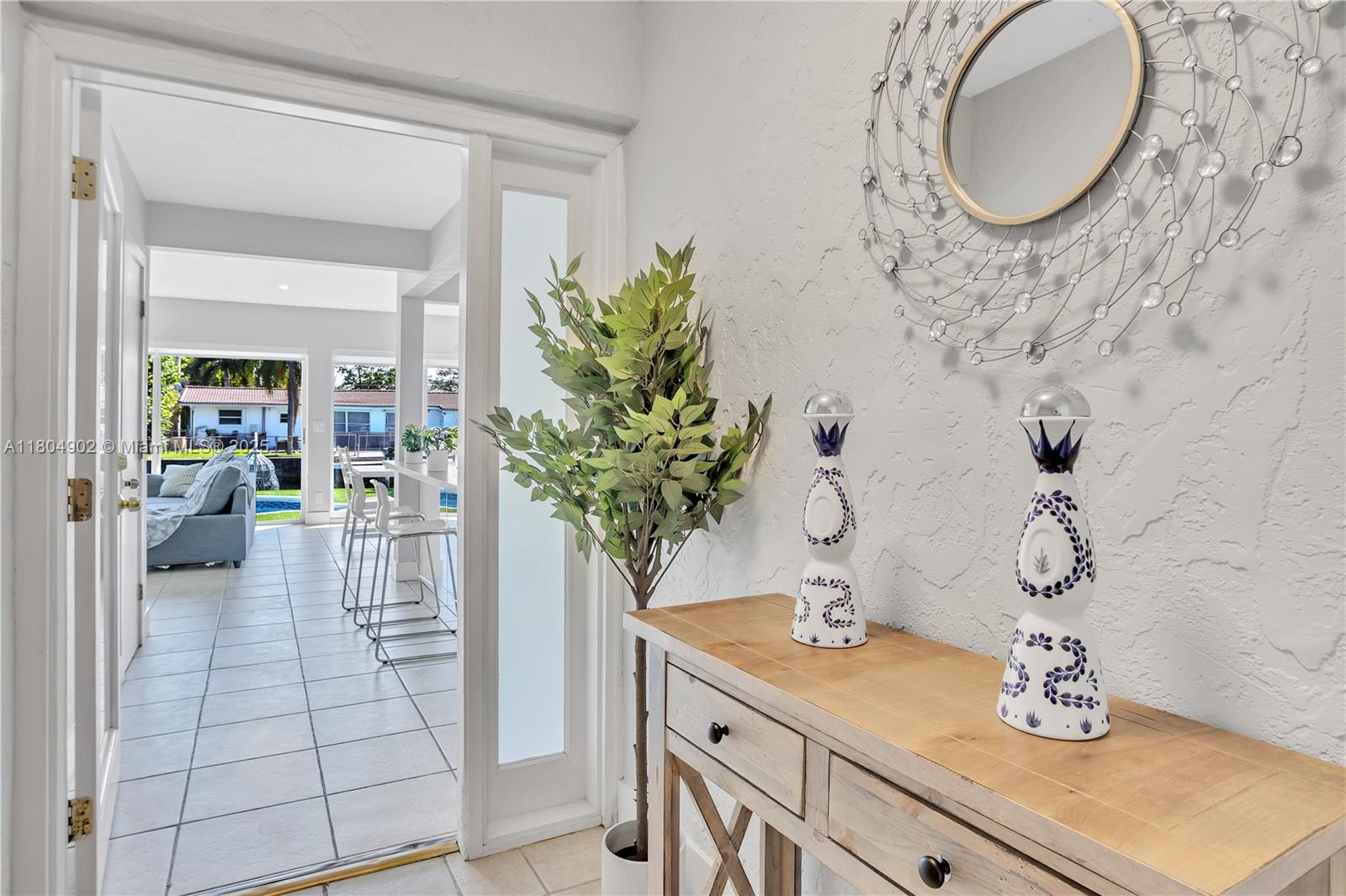 2828 Cleveland Street Hollywood, FL 33020 - Photo 7 of 23 a bathroom with a sink and mirror