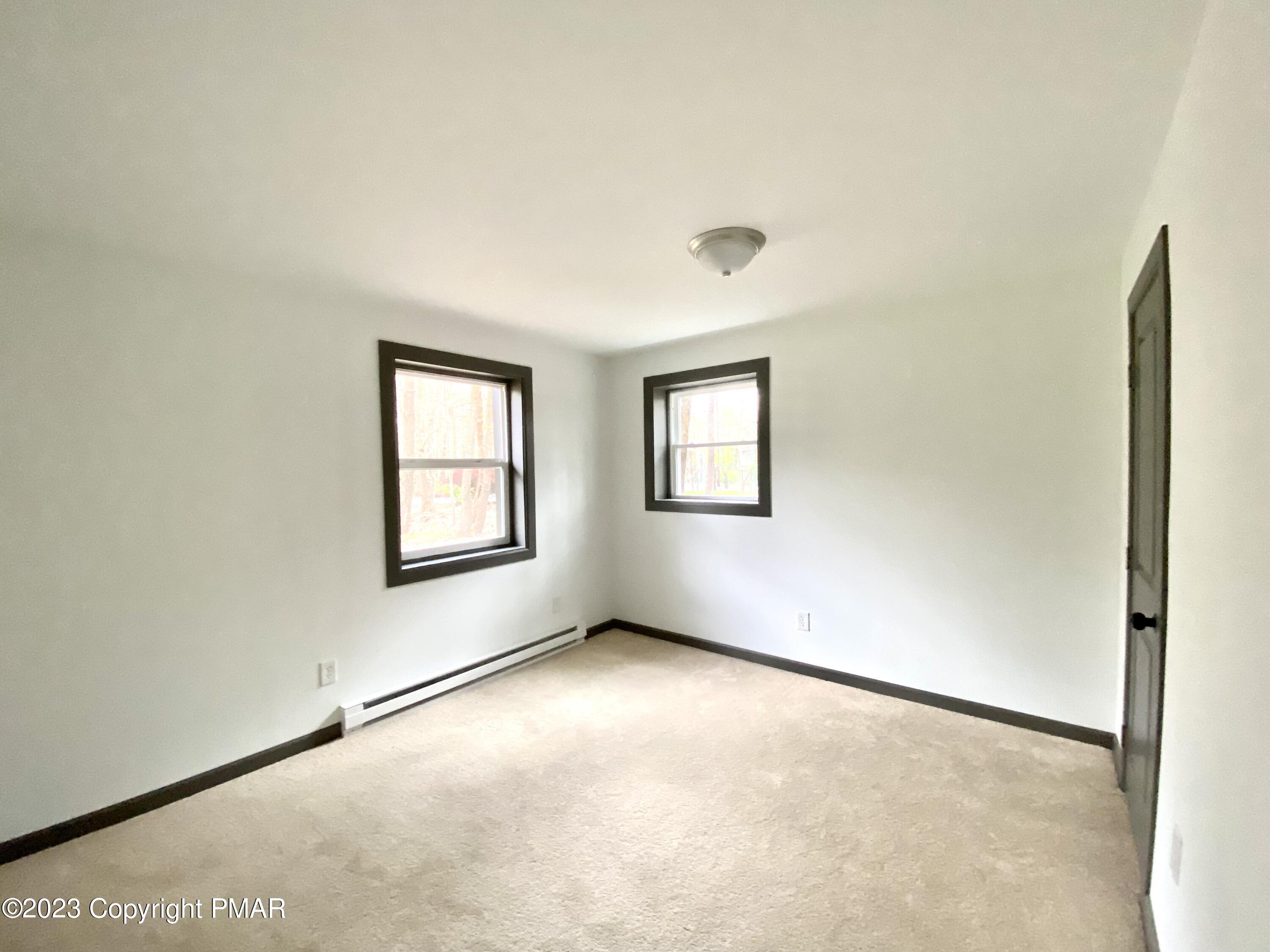 6267 Laurel Road Pocono Summit, PA 18346 - Photo 21 of 27 an empty room with windows