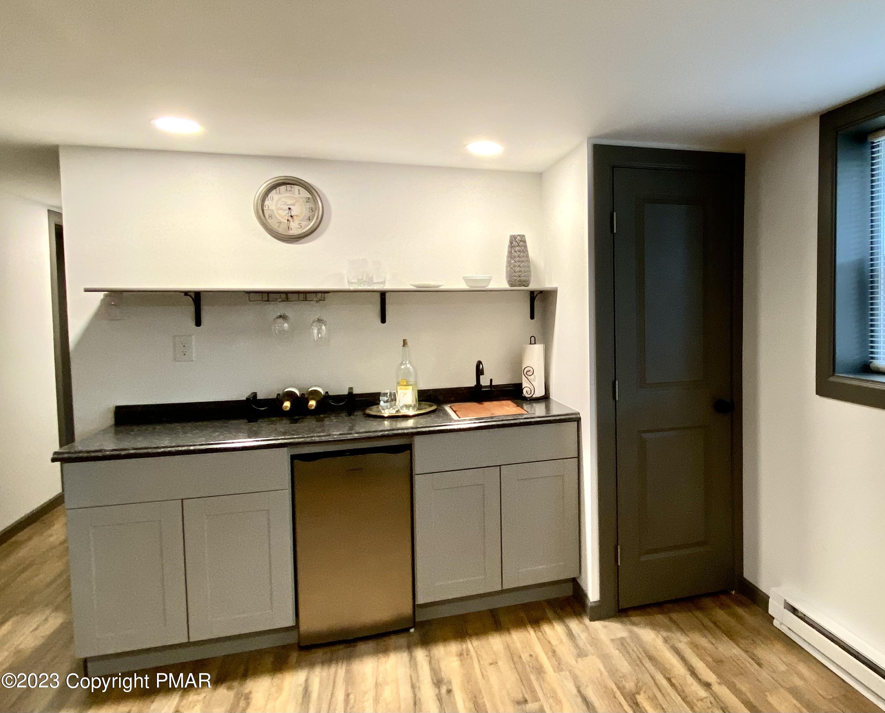 6267 Laurel Road Pocono Summit, PA 18346 - Photo 24 of 27 a kitchen with stainless steel appliances granite countertop a sink and a stove