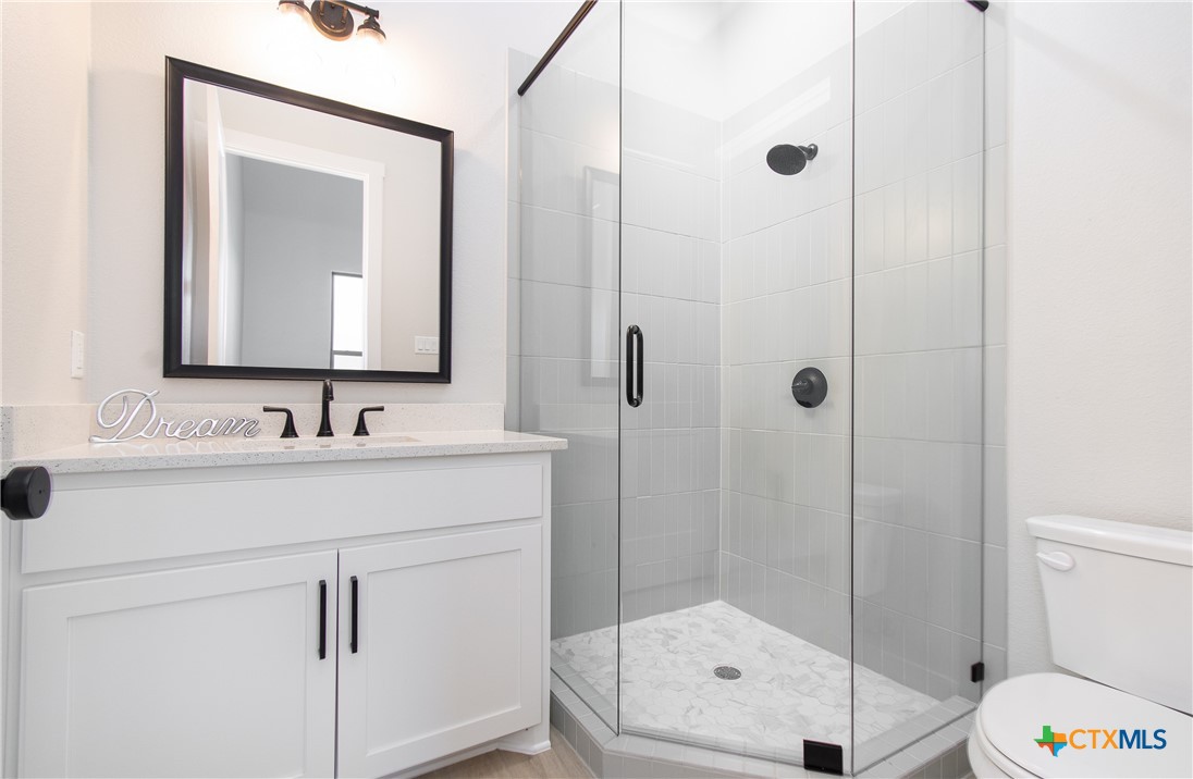 8152 Evenfall Lane Temple, TX 76501 - Photo 25 of 33 a bathroom with a sink a toilet and shower