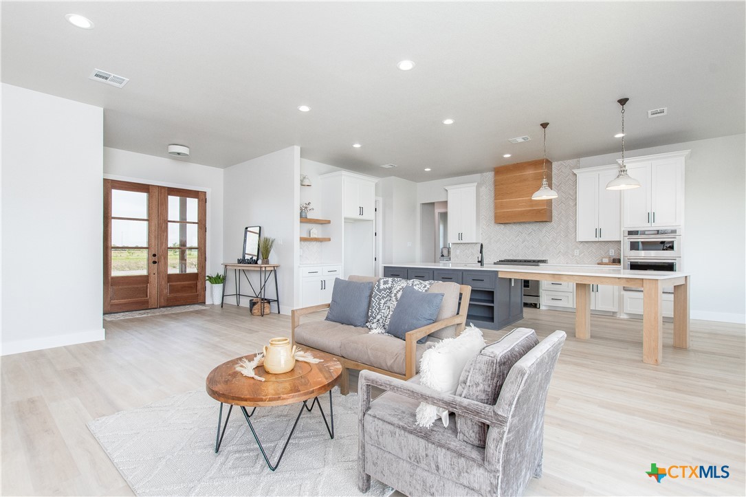 8152 Evenfall Lane Temple, TX 76501 - Photo 3 of 33 a living room with furniture and a view of kitchen