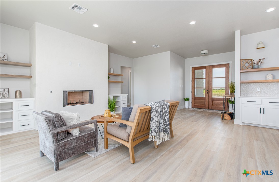 8152 Evenfall Lane Temple, TX 76501 - Photo 5 of 33 a living room with furniture and a wooden floor