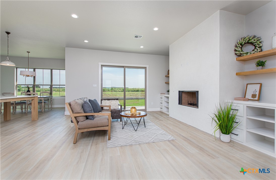 8152 Evenfall Lane Temple, TX 76501 - Photo 6 of 33 a living room with furniture and a wooden floor