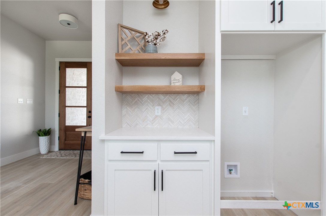 8152 Evenfall Lane Temple, TX 76501 - Photo 10 of 33 a view of white cabinets and wooden floor