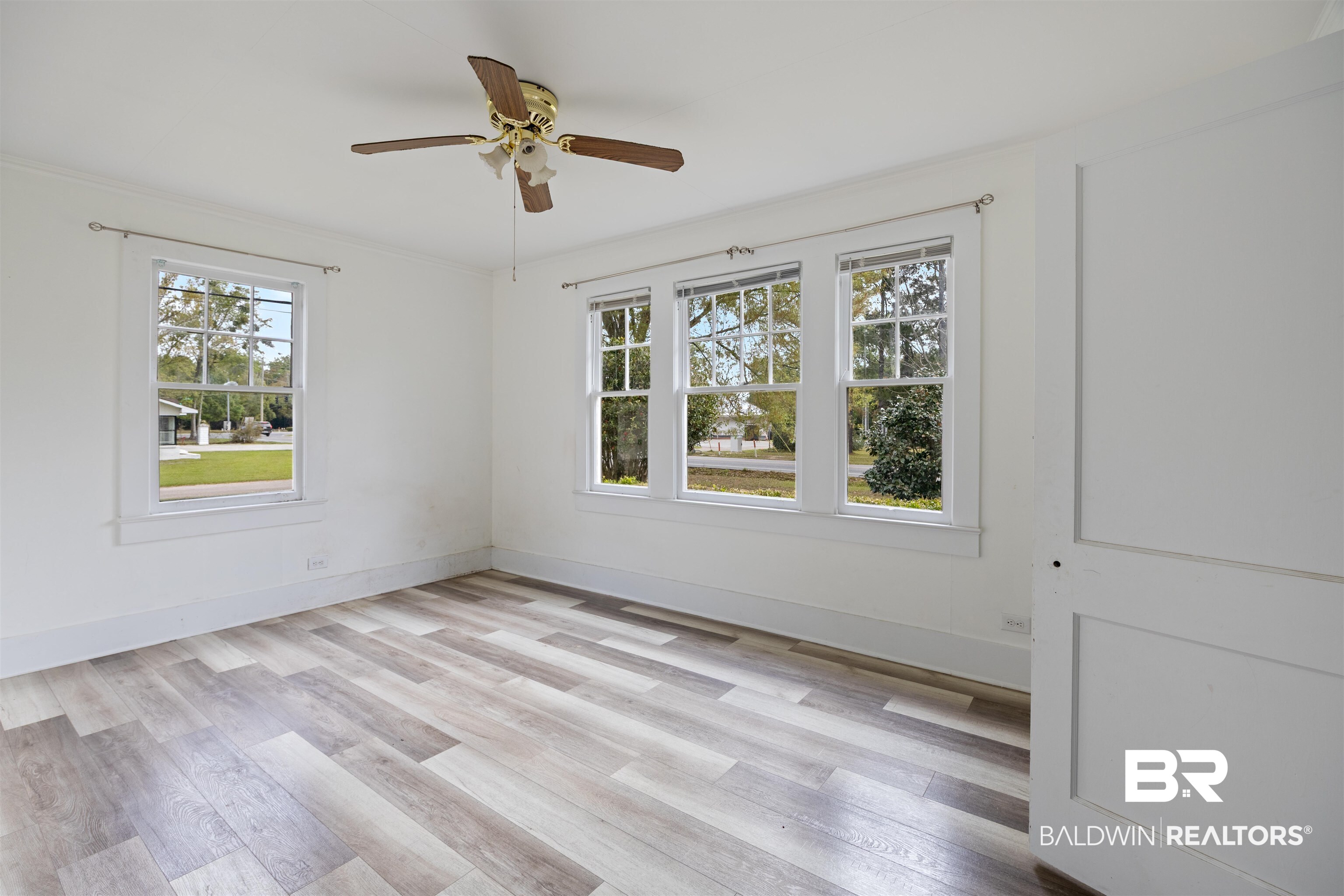 112 South Juniper Street Foley, AL 36535 - Photo 44 of 64 Unfurnished room featuring light wood-type flooring and a ceiling fan